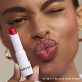 Jessica Alba applying Honest Tinted Lip Balm
