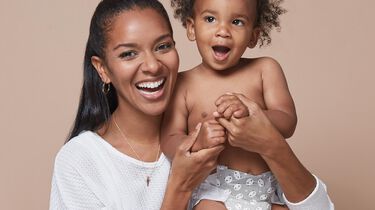 close up of mom and baby smiling