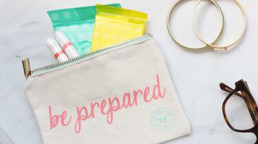 bag with feminine products spilling out the top of it