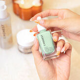 Woman holding Green Juice Serum