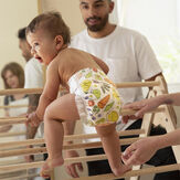 Baby wearing "So Delish" Honest diaper print