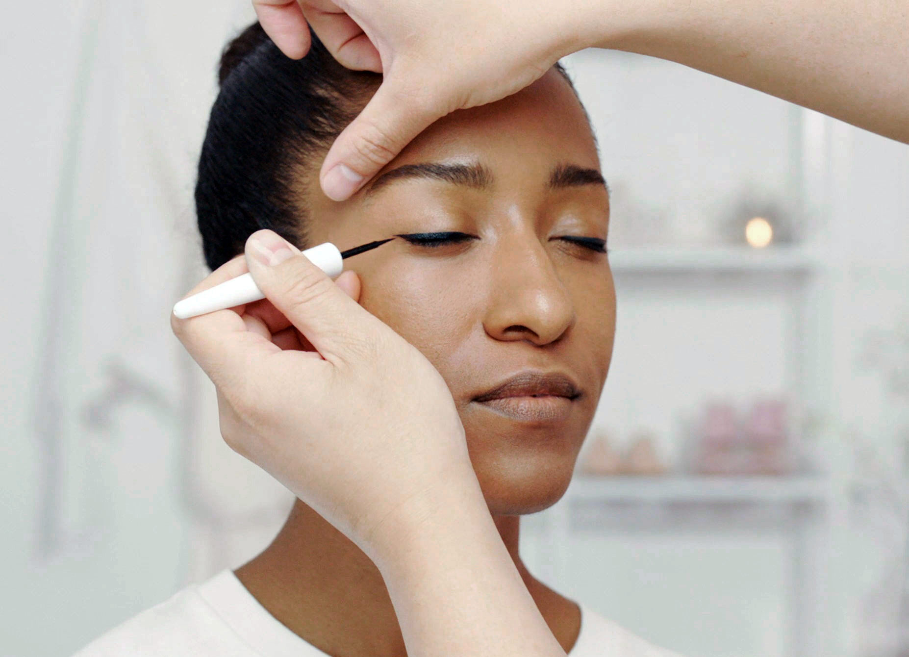 Applying eyeliner shop