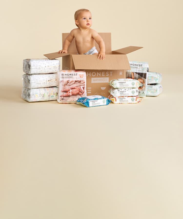 baby in box of diapers