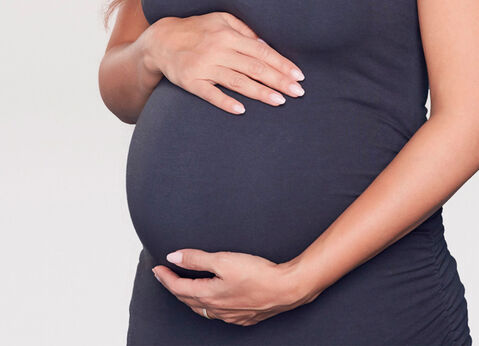 pregnant mama touching her belly