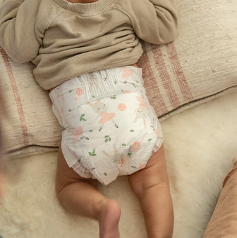 baby wearing a diaper with a rabbit ballerina print