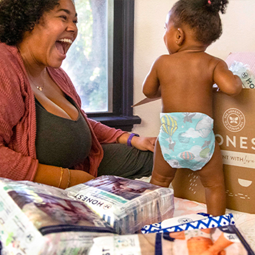 baby in above it all diaper opening honest diapers + wipes subscription box with mom