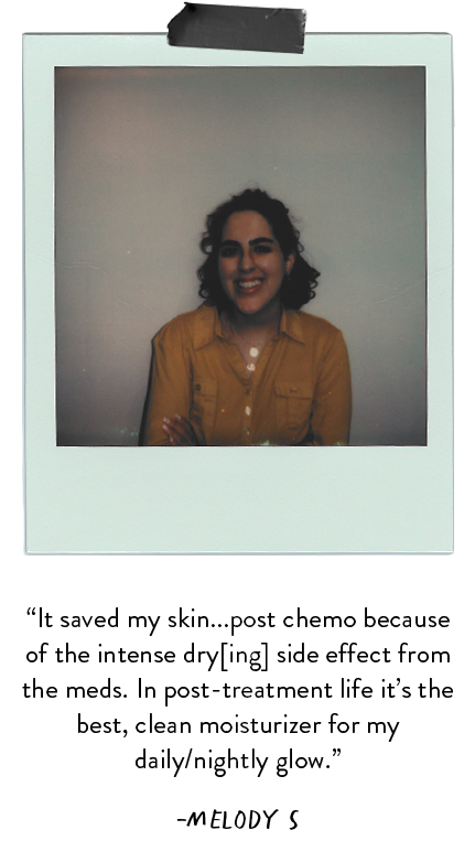 Polaroid photo of woman wearing orange shirt.