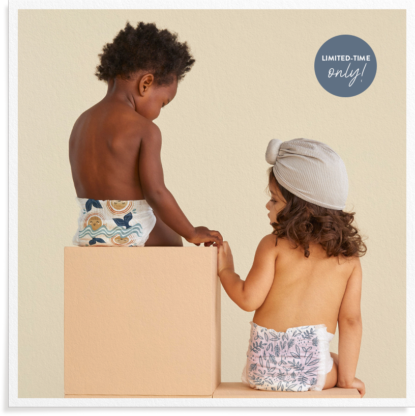 Baby wearing Honest Summer print diaper