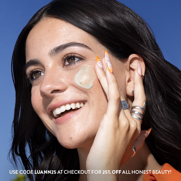 Luann Diez applying Daily Green Juice Serum on cheek