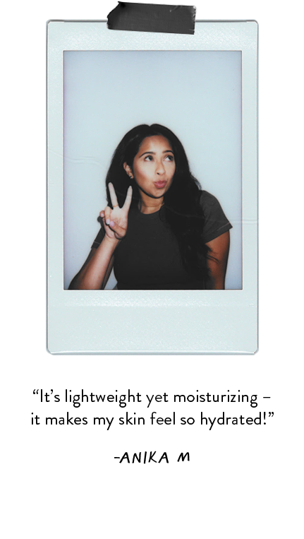 Polaroid photo of woman wearing black t-shirt and posing with the peace sign