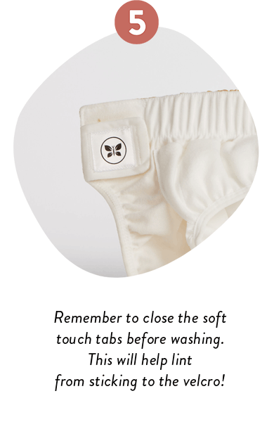 Remember to close the soft touch tabs before washing. This will help lint from sticking to the velcro!