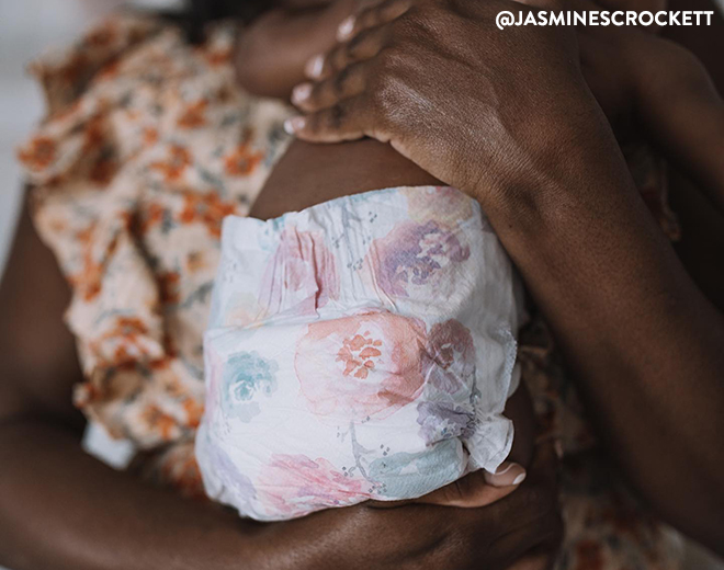 Mom holding baby in Rose Blossom Diaper