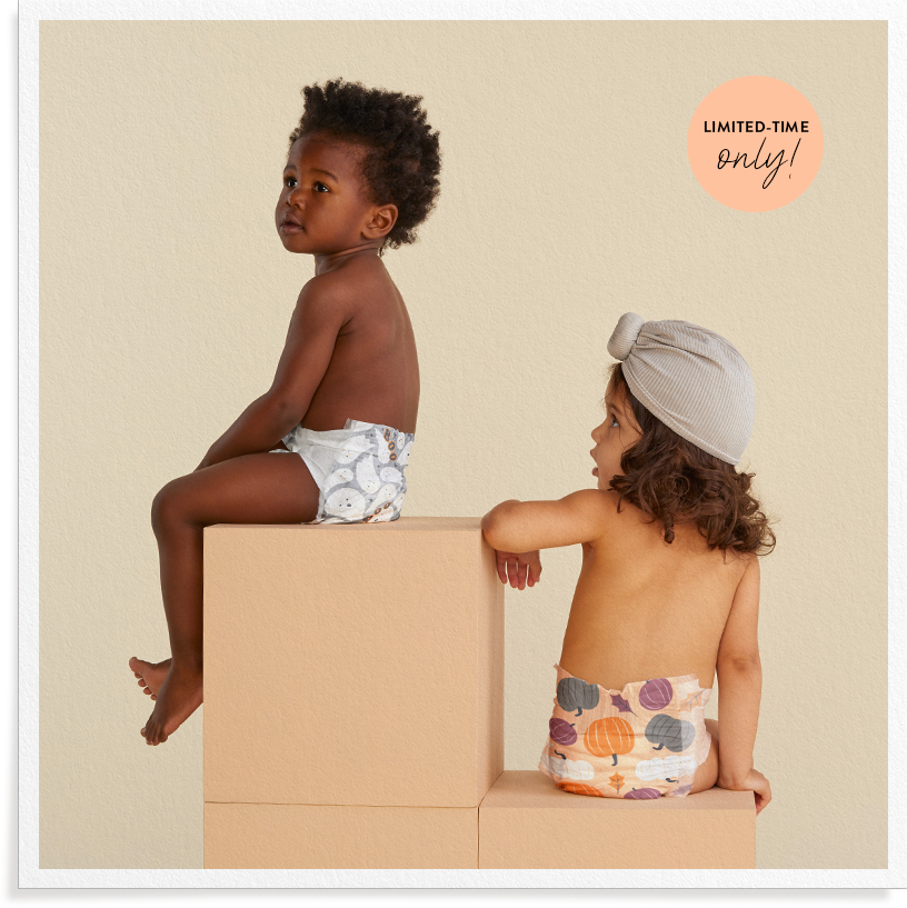 Baby wearing Honest Summer print diaper